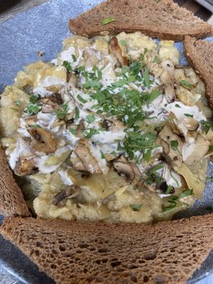 Baked eggplant with artichoke, mushrooms, parsley and tahini   at Safsal in Tel Aviv