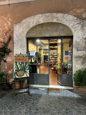 Lovely library upon entering, restaurant is to the left    at Bibliothe in Rome