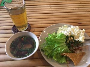 Noodle dish with vegetables and tofu. Small soup. Hot tea at Giac Tha in Ho Chi Minh City