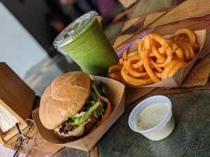 Crispy "CHK" Burger! With some curly fries and the Green Power -7 smoothie at The Dragonfly in Ocala