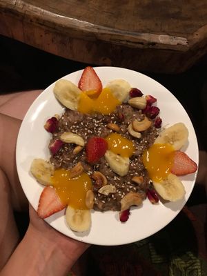 Vegan brown rice pudding with mango purée, fruits and nuts  at Joy in Candolim