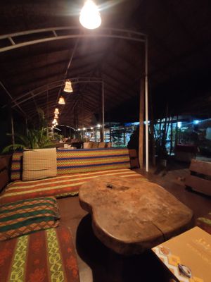 Seating area in the restaurant at Joy in Candolim