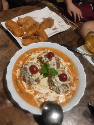 Brown rice balls in a creamy cheesy sauce. Vegan option available. at Joy in Candolim