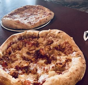 One vegan pizza for me and one nonvegan pizza in the back for my meat eating bestie  at Mellow Mushroom in Farragut