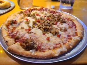 Vegan pizza with tempeh, red pepper and follow your heart cheese. Super good! at Mellow Mushroom - Parkway in Pigeon Forge