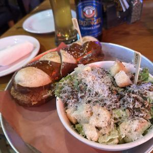 Plant-Based Schnitzel Pretzel’wich with the Plant-Based Caesar Salad (side)  at Beertown Public House in Waterloo