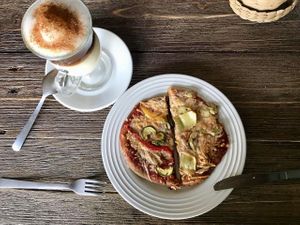 Two vegan pizzas and a cappuccino with almond milk at Sattvika Eco Panaderia in San Andres Cholula