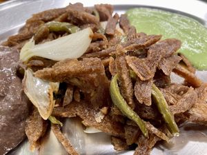 Carnitas vegetarianas, con guacamole y frijoles refritos.  at Yug in Mexico City