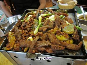 huge faux-meat dish served on a heated grill with tortillas and salsa - definitely for sharing at Yug in Mexico City