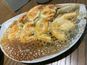 Pan-fried assorted dumplings (10, half cabbage & sweetcorn, half mustard greens) at Rén Lǐ Jū 仁里居 - Yuli Your Home in Taipei