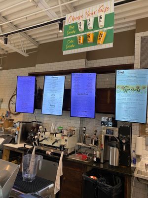 Screen menus behind the counter at The Remedy Exchange in Wakefield