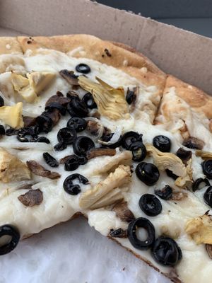 build your own pizza with oil and garlic base, extra vegan cheeze, mushrooms, olives, onion, and artichoke hearts omnomnomnomnom   at Mellow Mushroom in Fayetteville