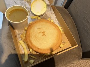 Pizza supper with curry sauce   at Gino's Fryer  in Largs