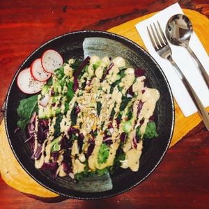 Sweet potato and broccoli salad special with kale, red onion, purple cabbage, toasted sunflower seeds and creamy tahini dressing at Prana Center in Da Lat