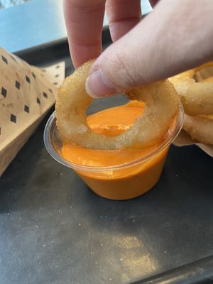 Onion ring and hot pepper sauce  at Swing Kitchen - Georgenstraße in Berlin