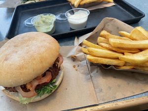 Swing burger, chips and lemon basil dip and garlic dip  at Swing Kitchen - Georgenstraße in Berlin