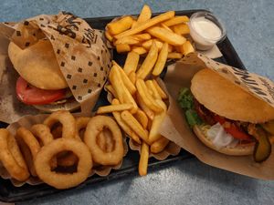 2x Swing burger combo  with fries (12,40€ each),  onion rings. at Swing Kitchen - Georgenstraße in Berlin