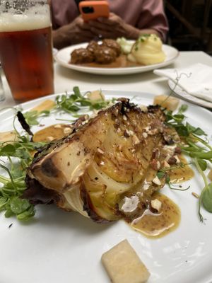 Grilled cabbage in mustard sauce and almonds   at Nomad in Stockholm