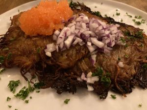 Hash Brown with onions and seaweed caviar  at Nomad in Stockholm