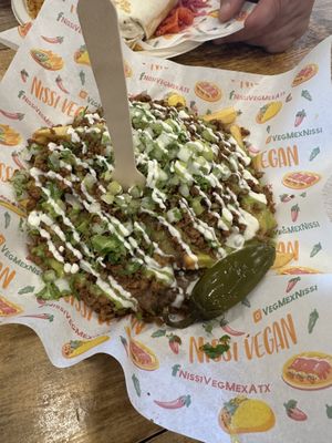 Carne asada fries. Very goodd  at Nissi Vegan in Austin