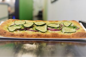 Cheesy veggie flatbread special  at Alkalicious Cold Pressed Juice Bar in Chesapeake