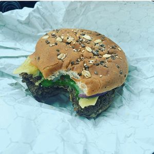 Katie managed to snap a pic before her black bean cheeseburger was all in her belly!  at Alkalicious Cold Pressed Juice Bar in Chesapeake