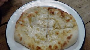 Garlic bread with vegan cheese at Rustico in Hastings