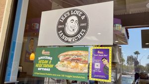 The Long Beach Ike's has a big sign showcasing their Vegan and Vegetarian menu. at Ike's in Long Beach