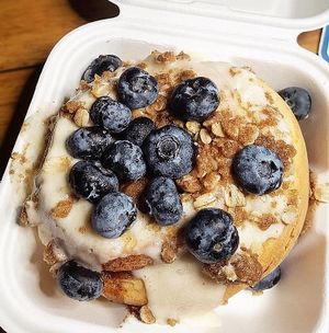 Cream cheese frosting, blueberries, pie crumble  at Cinnaholic  in Knoxville