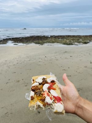 Pizza slice  at Rios Vegan Food in Puerto Viejo De Talamanca