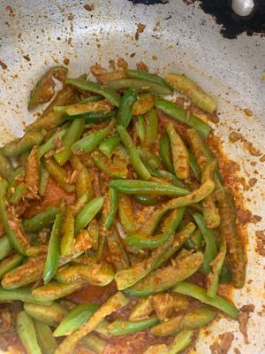 Wine Gourd. Giloda in Gujarati.  Cooked in garlic spices and tomatoes  at Delhish in Oxford