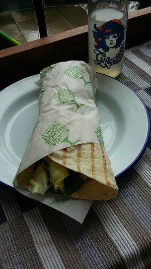 Crispy chickless special wrap with a bottle of Gingerella! at Roots & Shoots Cafe in Bath