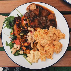 the taster box with salads, mac and cheeze and aubergine and kidney bean stew at Roots & Shoots Cafe in Bath