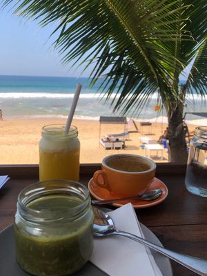Local porridge, fresh juice and coconut cappuccino with a view. at Salty Swami's in Hikkaduwa