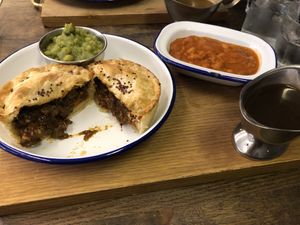 Kevin with mushy peas and baked beans at Pieminister in Birmingham