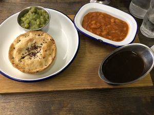 Kevin with mushy peas, gravy, and baked beans at Pieminister in Birmingham