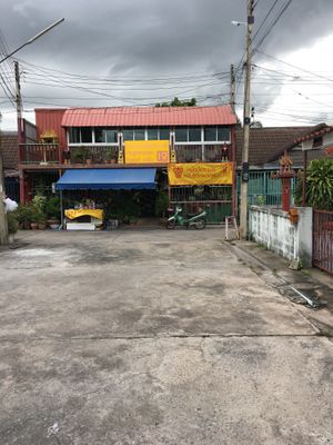 Walking down Street Toward Cafè at Mhee Yim Vegetarian Food in Hua Hin