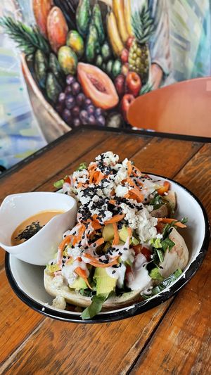 pita pocket with greens, avocado, almond cheese, avocado, etc at Peace & Bowl in Playa Del Carmen
