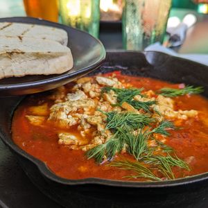 Vegan shakshuka  - tofu baked in spicy tomato sauce with cumin, fresh dill and garlic grilled ciabatta at Moondog in Key West