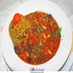 Sicilian eggplant Caponata with pine seeds, raisins, capers, olives and tomatoes. Served with Moroccan couscous. 
 at Lei e Lui in Berlin