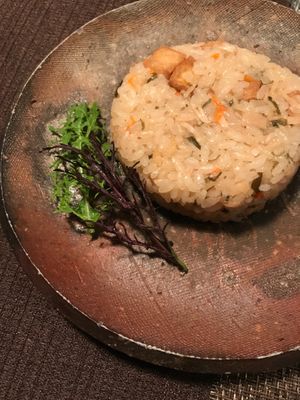 Mushroom tofu fried rice served with a green spice dusting on the side at Natural House Pumpkin in Hakuba