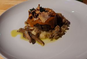 Fermented beans, mushroom loaf, creamy polenta, wild mushrooms, fermented strawberry sauce at Magu in Helsinki