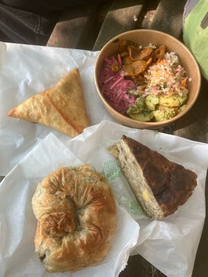vegan quiche, spinach pastry, veg samosa, and some of the salad options at The Purple Carrot in Malton