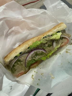 Hummus & Veggie sandwich - dripping with canola oil  at Namaste in Caye Caulker