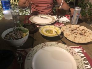 Hummus, yalanji and tahin salad with delicious bread! Paper straws are used!  at Sufra in Amman