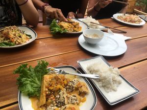Top left to bottom right: Mango salad, stuffed orange tofu, papaya Sala, stuffed orange tofu at Veggie Box in Phong Nha