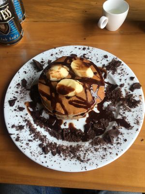 Pancakes with banana and chocolate syrup at Veggie Box in Phong Nha