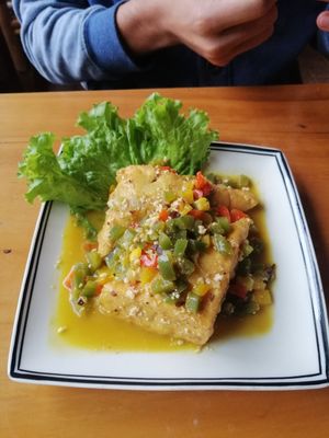 Tofu stuffed with vegetables in orange sauce at Veggie Box in Phong Nha