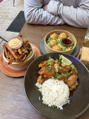 Tempura edamame and sweet potato fries, momos, sweet and sour tempura chicken with ricee  at Nooch in Bern