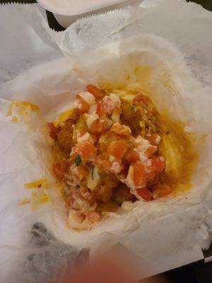 Nacho Tots with sour cream, queso, and pico de gallo at The BE-Hive in Nashville